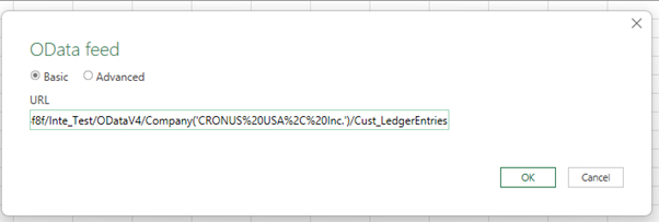 A screenshot of the Excel 'OData feed' dialog box, showing a Business Central OData V4 URL for 'Cust_LedgerEntries' pasted into the URL field.