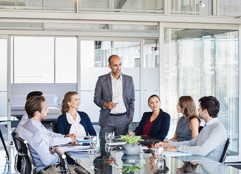 Team of experts in a meeting room discussing software consulting and technical advisory strategies