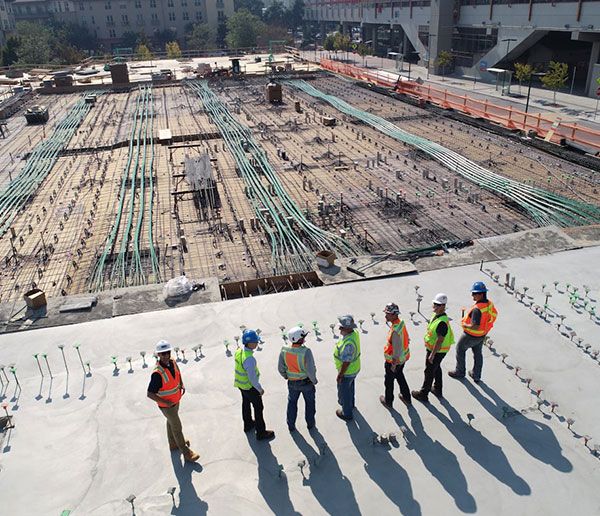 Construction site seen from above with crews at work