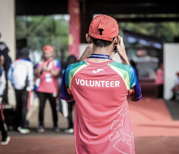 Volunteer in a marked vest at a community event